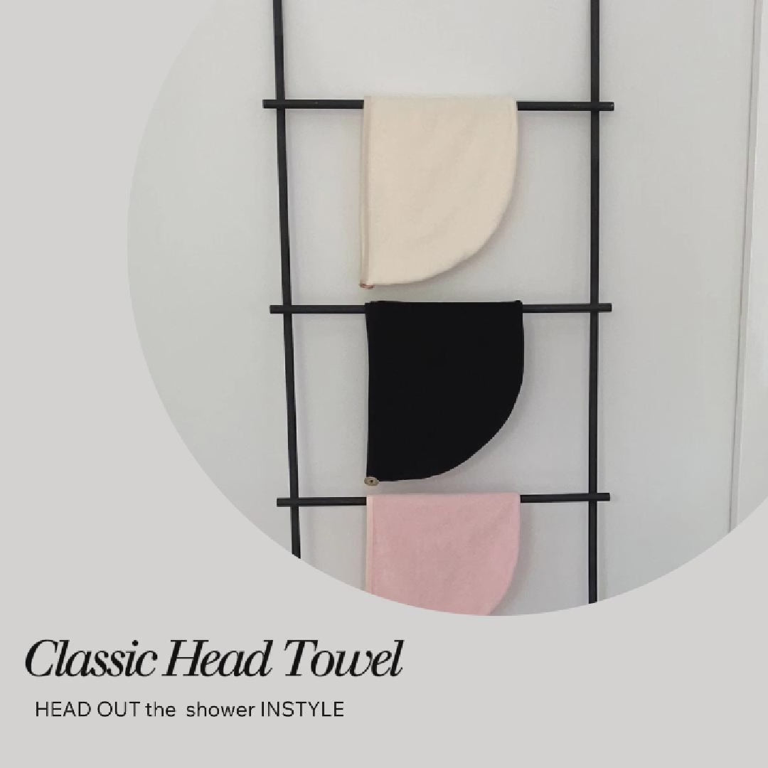 Demonstration of how to use the Dry Dolly Classic Head Towel to wrap and secure hair after showering.